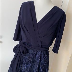 Navy midi dress with rosette skirt